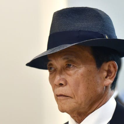 Japan's richest minister Taro Aso returns year's salary as heads roll ...