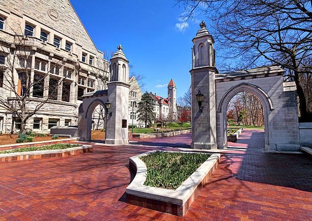 Indiana University Bloomington, Indiana, USA - March 21, 2016: Daytime view of the The Sample Gates, entrance to Indiana University from Kirkwood Ave  bloomington indiana stock pictures, royalty-free photos & images