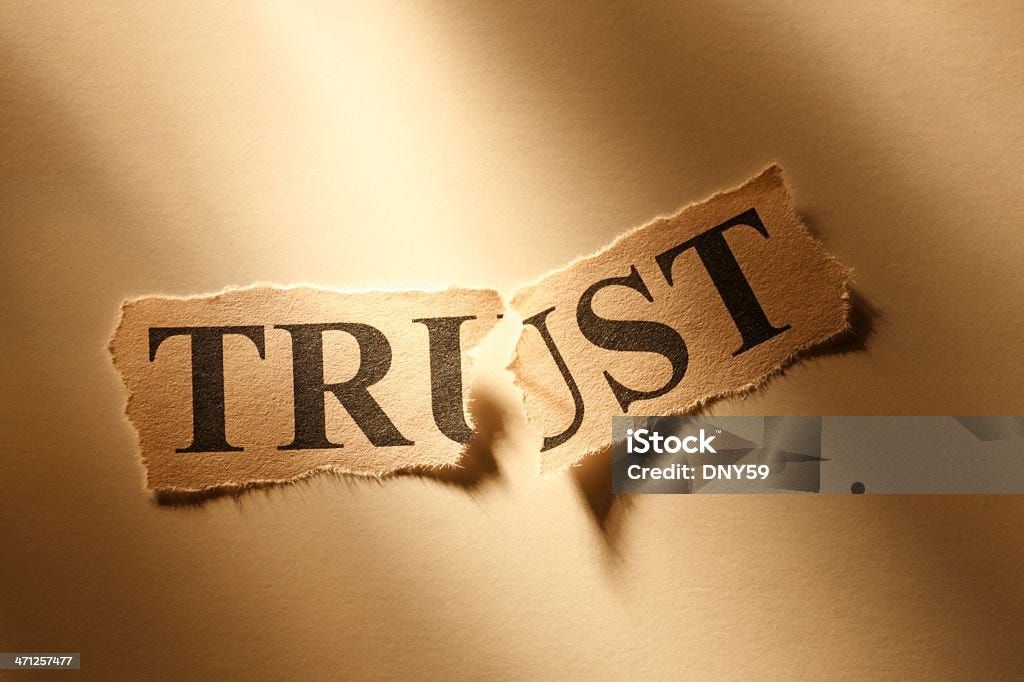 Broken Trust The word "Trust" torn in half. Trust Stock Photo Broken Trust The word "Trust" torn in half. Trust Stock Photo