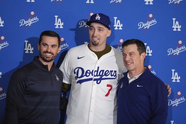 Los Angeles Dodgers pitcher Blake Snell, center, poses for photos with president of baseball operations Andrew Friedman, right, and general manager Brandon Gomes during a news conference Tuesday, Dec. 3, 2024, in Los Angeles. (AP Photo/Jae C. Hong) Los Angeles Dodgers pitcher Blake Snell, center, poses for photos with president of baseball operations Andrew Friedman, right, and general manager Brandon Gomes during a news conference Tuesday, Dec. 3, 2024, in Los Angeles. (AP Photo/Jae C. Hong)
