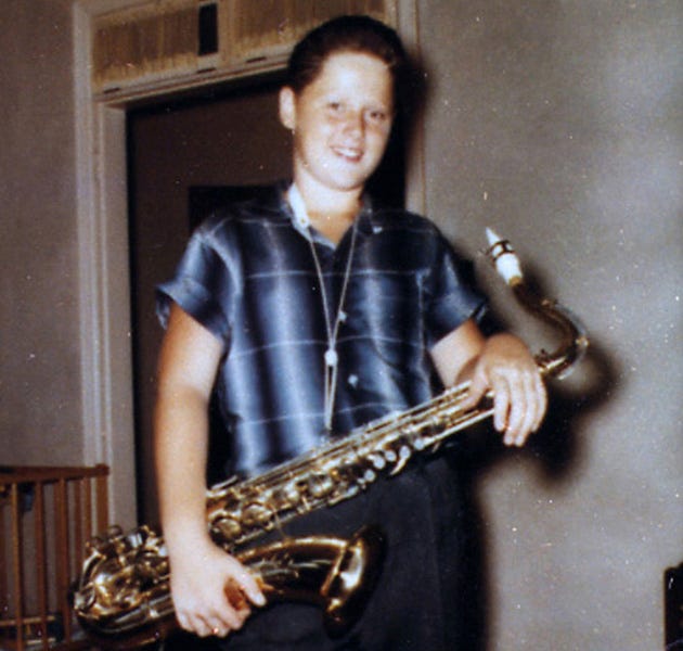 A young Bill Blythe, joyfully playing his saxophone, celebrating his 12th birthday at his Hot Springs, Arkansas home in 1958, hinting at his future charisma. A young Bill Blythe, joyfully playing his saxophone, celebrating his 12th birthday at his Hot Springs, Arkansas home in 1958, hinting at his future charisma.