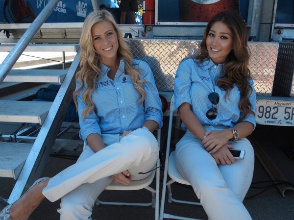 Podium girls in repose. Podium girls in repose.