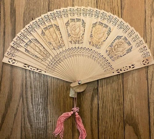 ASIAN HAND HELD WOODEN FAN W/ REPEATED ROSE PATTERN, PINK TASSLE, ORIGINAL BOX  - Picture 1 of 4