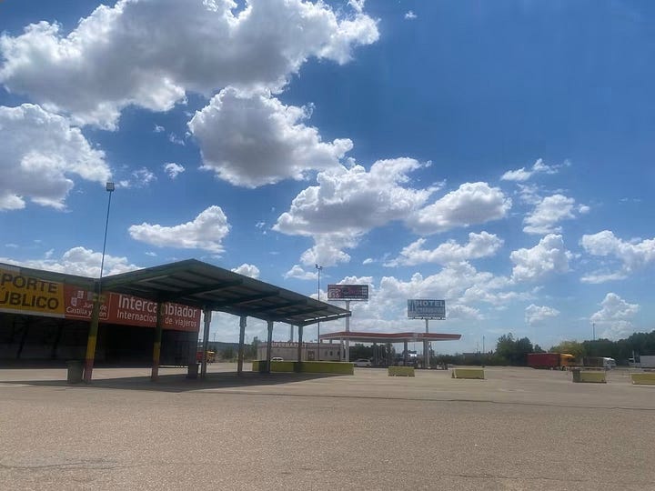 Spanish service station, and woman doing yoga in the picnic area