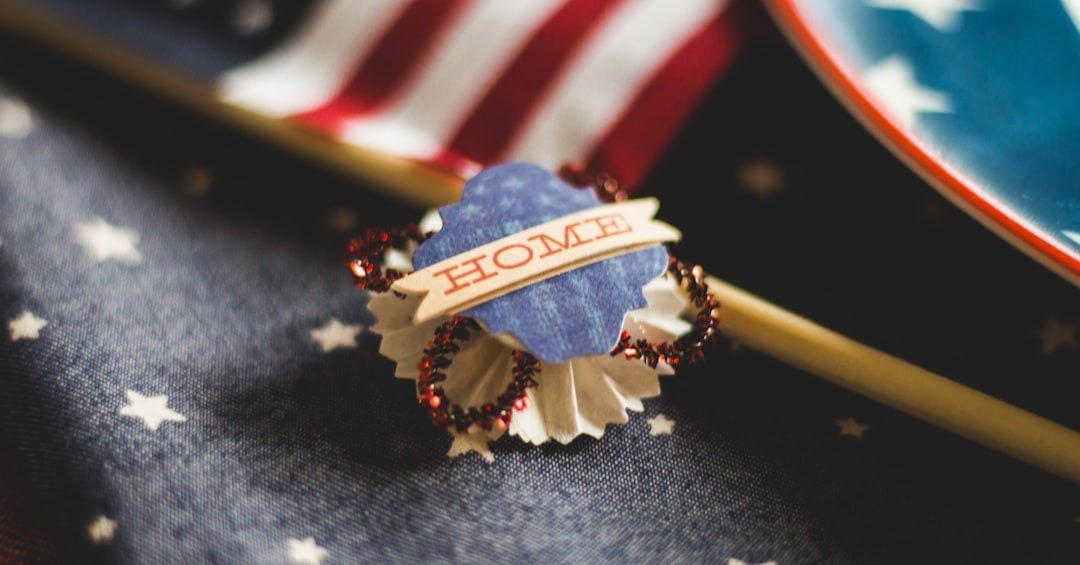 macro photography of american pin in front of american flag