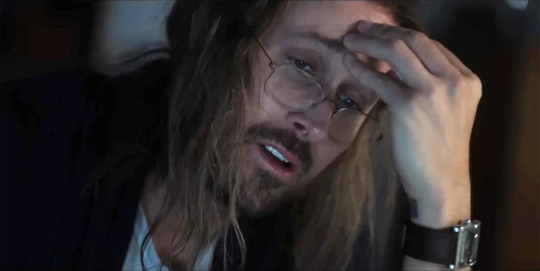 Close-up of a frustrated, obsessive-looking man with long hair and glasses resting his hand on his forehead, taken from the comedy sketch "Papyrus." The image is used humorously to represent a writer becoming increasingly consumed by a topic while researching and revising an article about expertise, organizational learning, and education. Close-up of a frustrated, obsessive-looking man with long hair and glasses resting his hand on his forehead, taken from the comedy sketch "Papyrus." The image is used humorously to represent a writer becoming increasingly consumed by a topic while researching and revising an article about expertise, organizational learning, and education.
