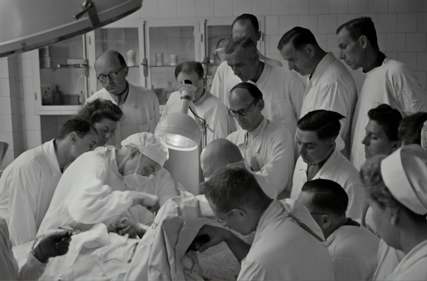 Group of doctors around a patient.