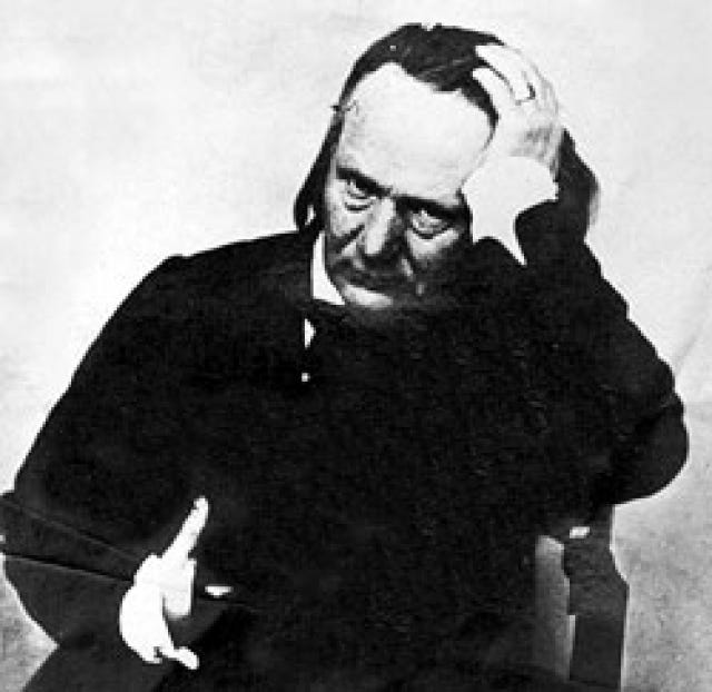 Young Victor Hugo with his hand on his head.