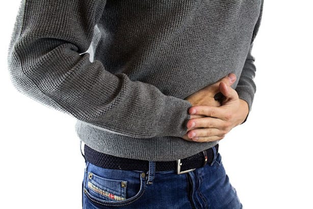 Man holding his tummy