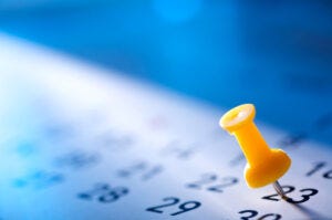 calendar with pushpin to represent white paper deadline