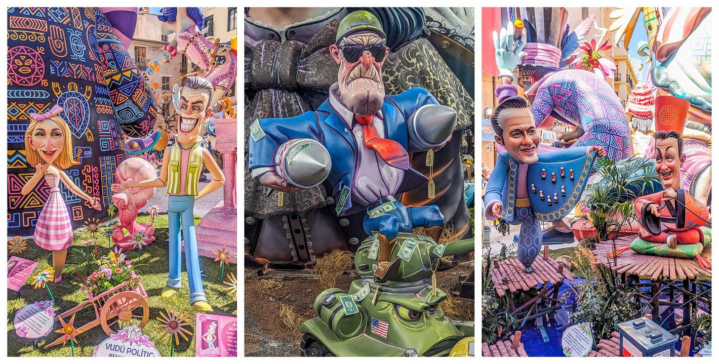 A man and a woman dressed in bright colors, a scary looking old man standing on a tank and clutching missiles, and two Spanish polititicans dressed like Chinese mandarins. 
