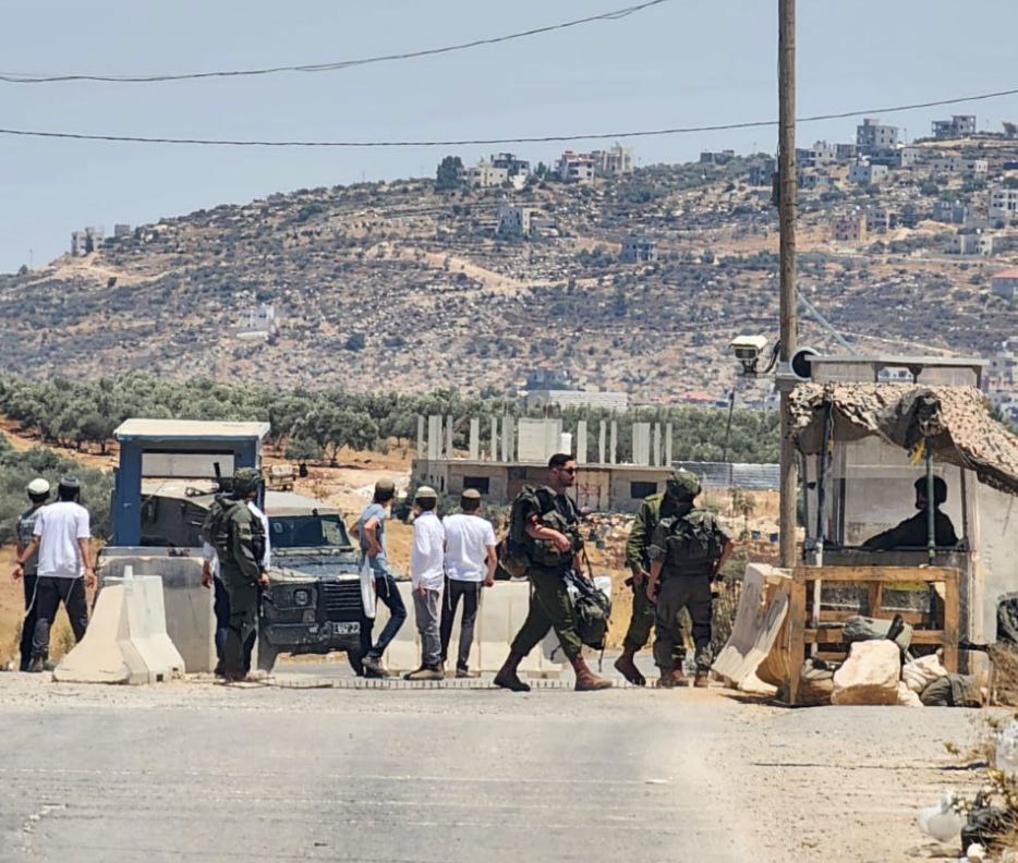 Israelis at Bayt Furik checkpoint. (Screen grab used in accordance with Clause 27a of the Copyright Law))