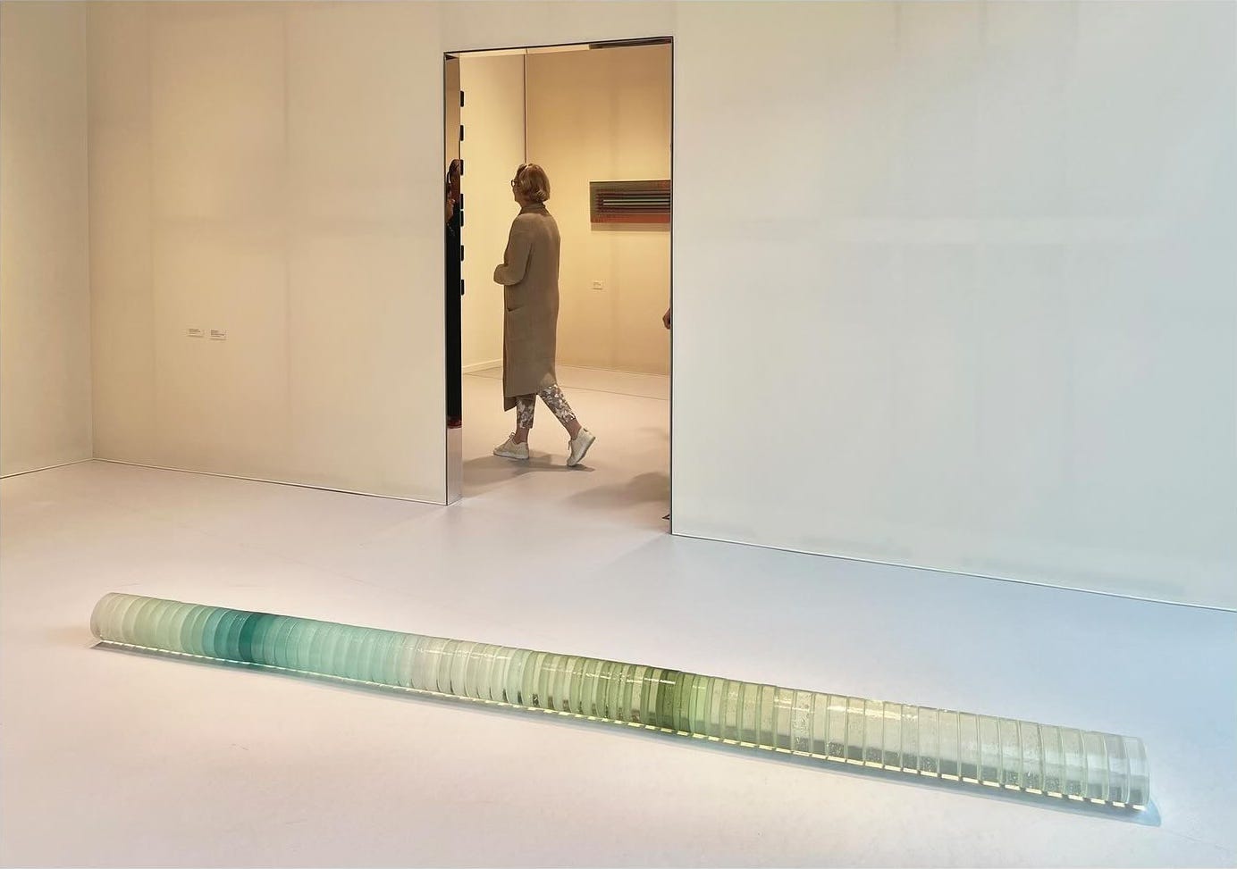 A Mirage installation in Munich. 70 glass slices representing the sands of 70 deserts are arranged into a cylinder on the floor. A Mirage installation in Munich. 70 glass slices representing the sands of 70 deserts are arranged into a cylinder on the floor.