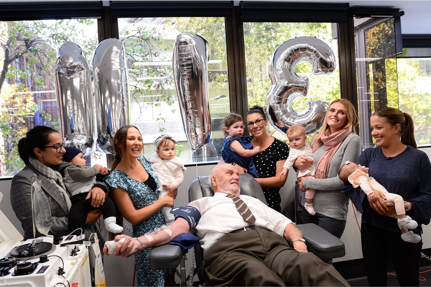 James Harrison making his final blood donation surrounded by mothers and their children in 2018 at the age of 81. Harrison reportedly died in his sleep on February 17.