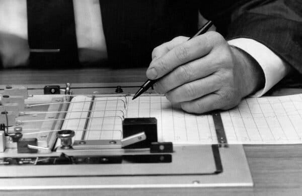 A black and white image of a polygraph test. A black and white image of a polygraph test.