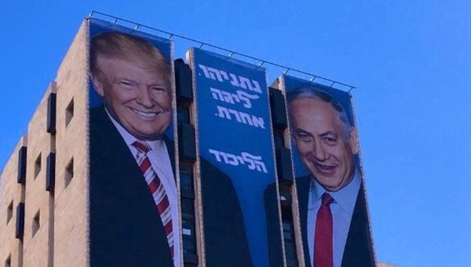 A Likud campaign poster features Donald Trump and Benjamin Netanyahu shaking hands. A Likud campaign poster features Donald Trump and Benjamin Netanyahu shaking hands.
