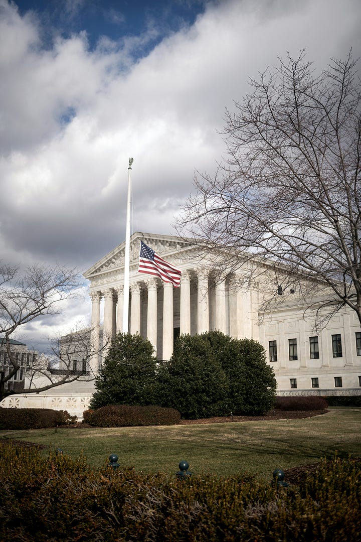 The Supreme Court building and an army tank