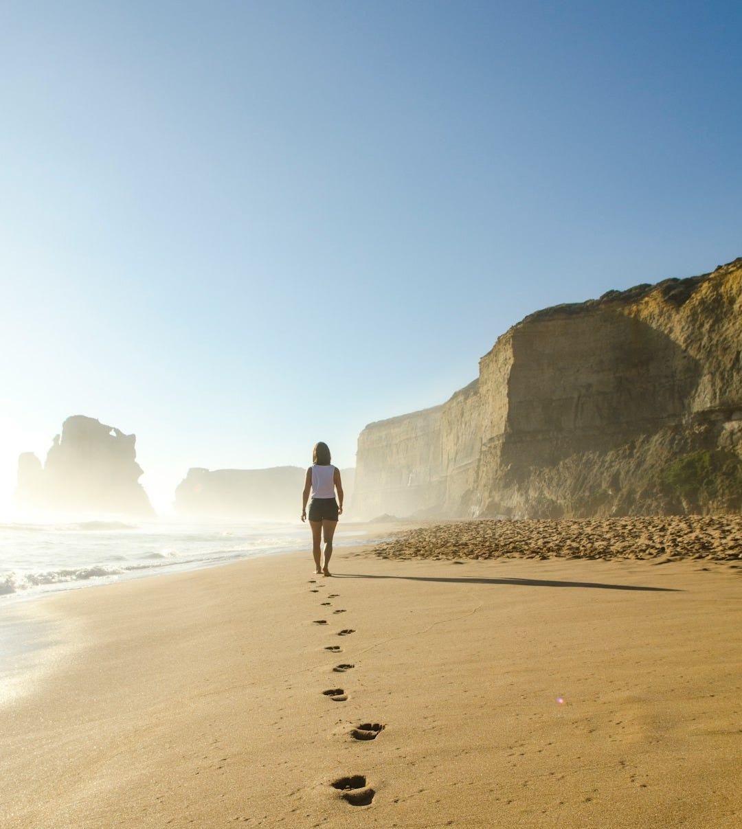 woman walking on shore