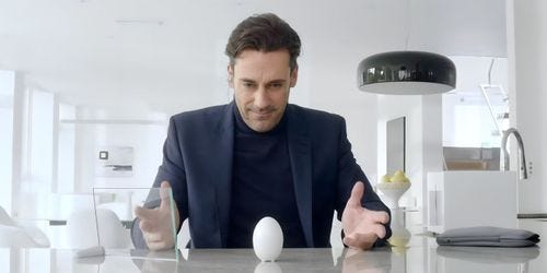 Jon Hamm as Matt Trent in Black Mirror White Christmas looking at the camera depressed.