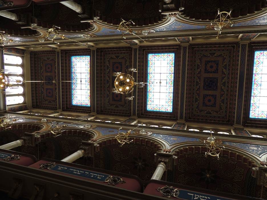 A ceiling with stained glass windows

AI-generated content may be incorrect.