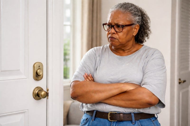Heavyset senior woman glares at key-only door