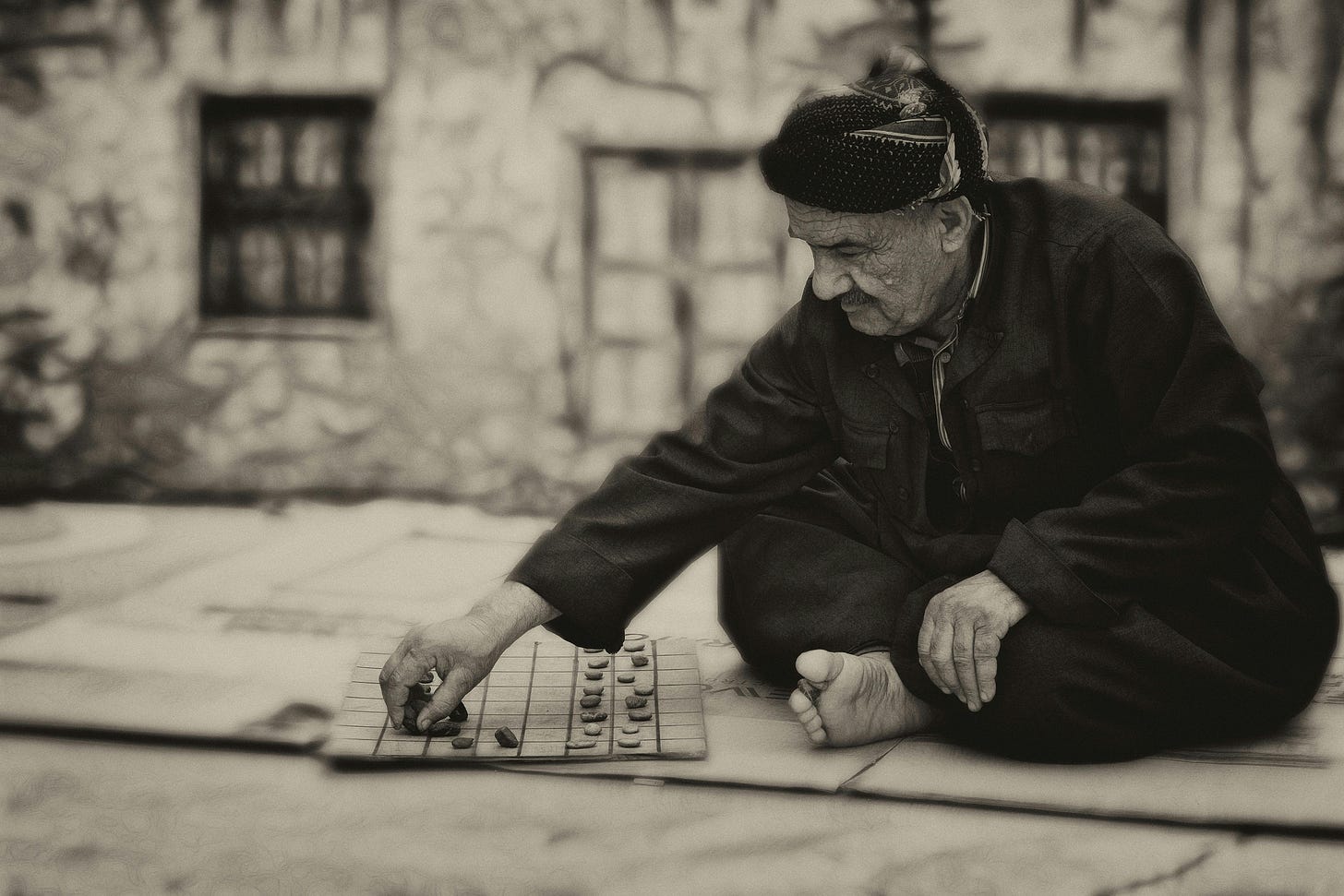 Elderly man playing a board game. Elderly man playing a board game.