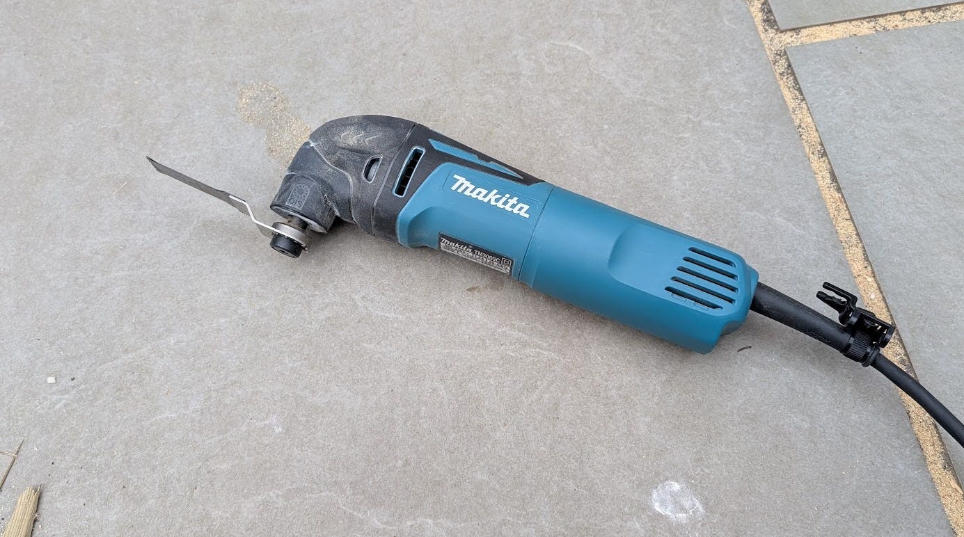 Makita Multi Tool used to cut nails on shed frame