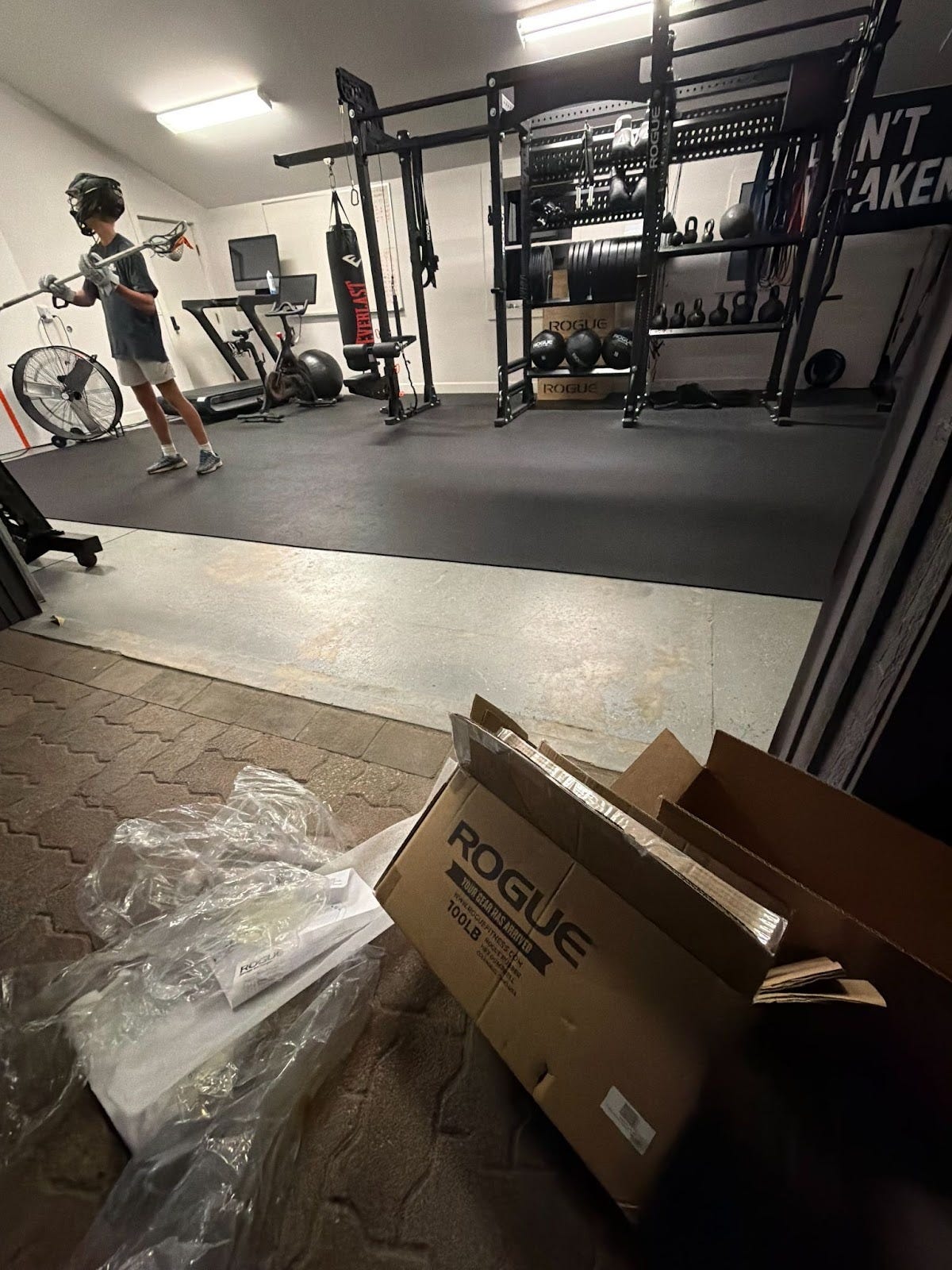 Late-night wall ball in the garage—the moments that happen at the edges of the day. When he wanders in for one more session, his mind loosens and real conversations happen.