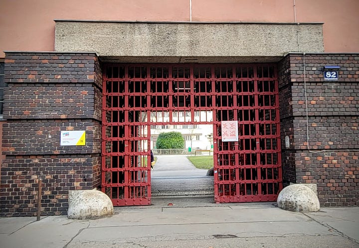 Two photos of the exterior of a large apartment block. The second photo depicts the main entrance to the interior courtyard.