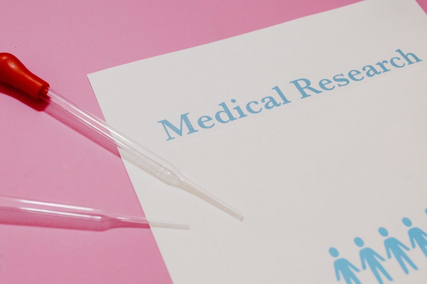 Photo by Tara Winstead on Pexels Close-up of a medical research document and pipette on a pink surface, highlighting scientific research and healthcare. (stock photo)