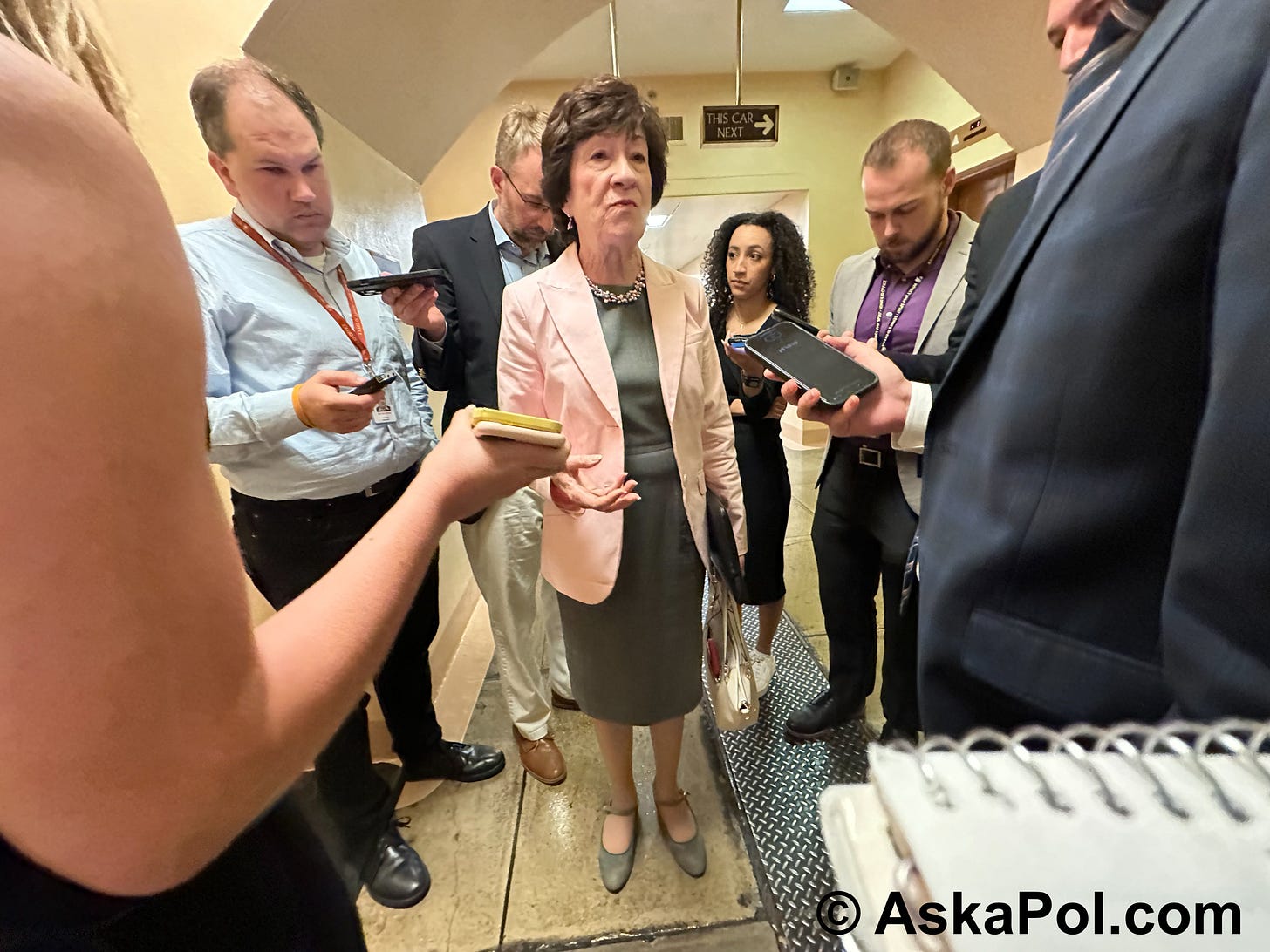 Reporters hold their phones out recording a female senator they're encircling in basement of US Capitol Photo: Matt Laslo © www.askapol.com Reporters hold their phones out recording a female senator they're encircling in basement of US Capitol Photo: Matt Laslo © www.askapol.com