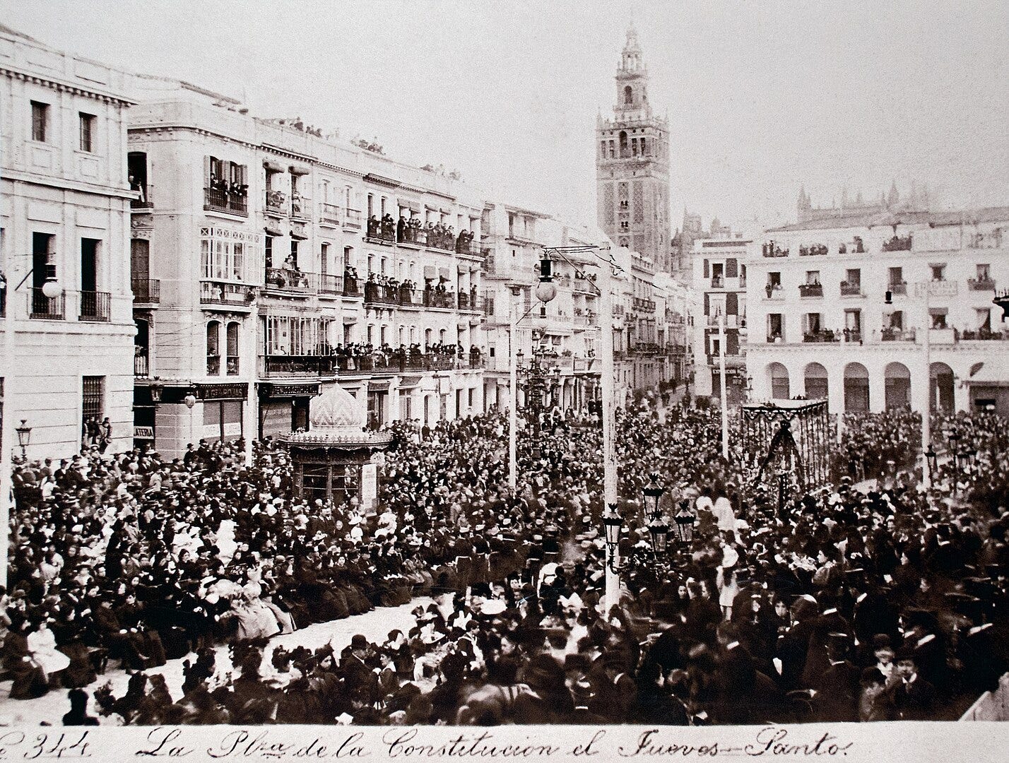 Photograph of the Maundy Thursday procession at the Plaza de San Francisco, Seville, 1885