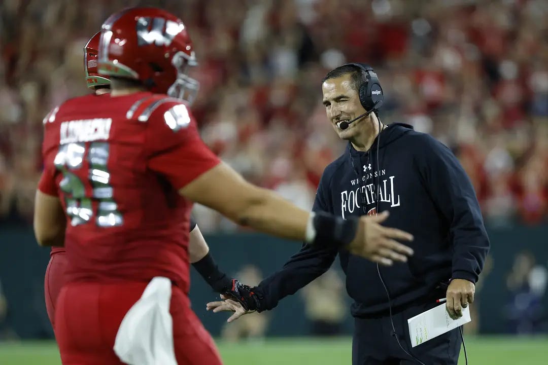 Wisconsin Badgers head coach Luke Fickell and center Austin Kawecki. Wisconsin Badgers head coach Luke Fickell and center Austin Kawecki.