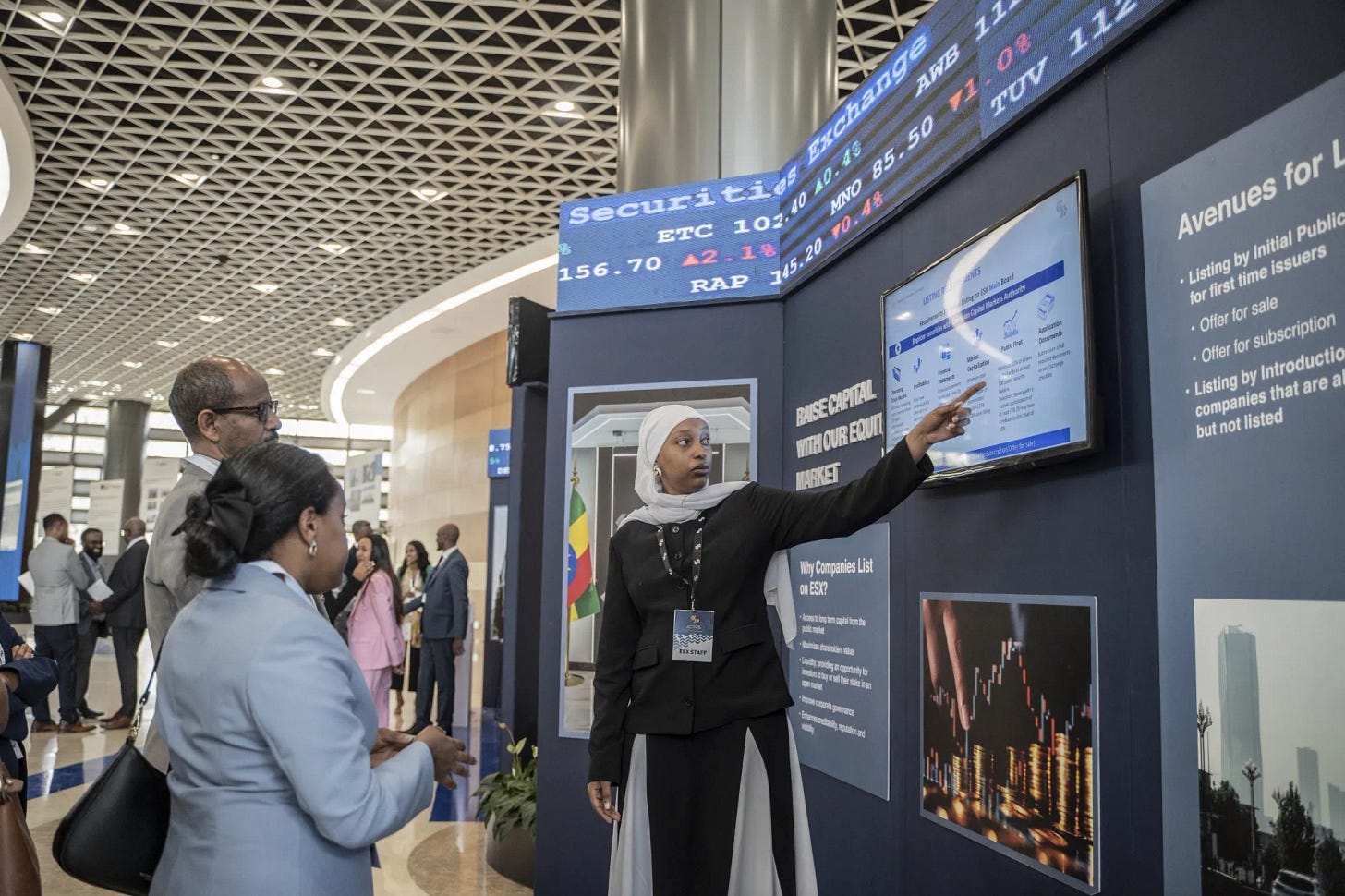 People look at a stock chart during the launch of Ethiopian Securities Exchange in Addis Ababa, Ethiopia, on Jan. 10.