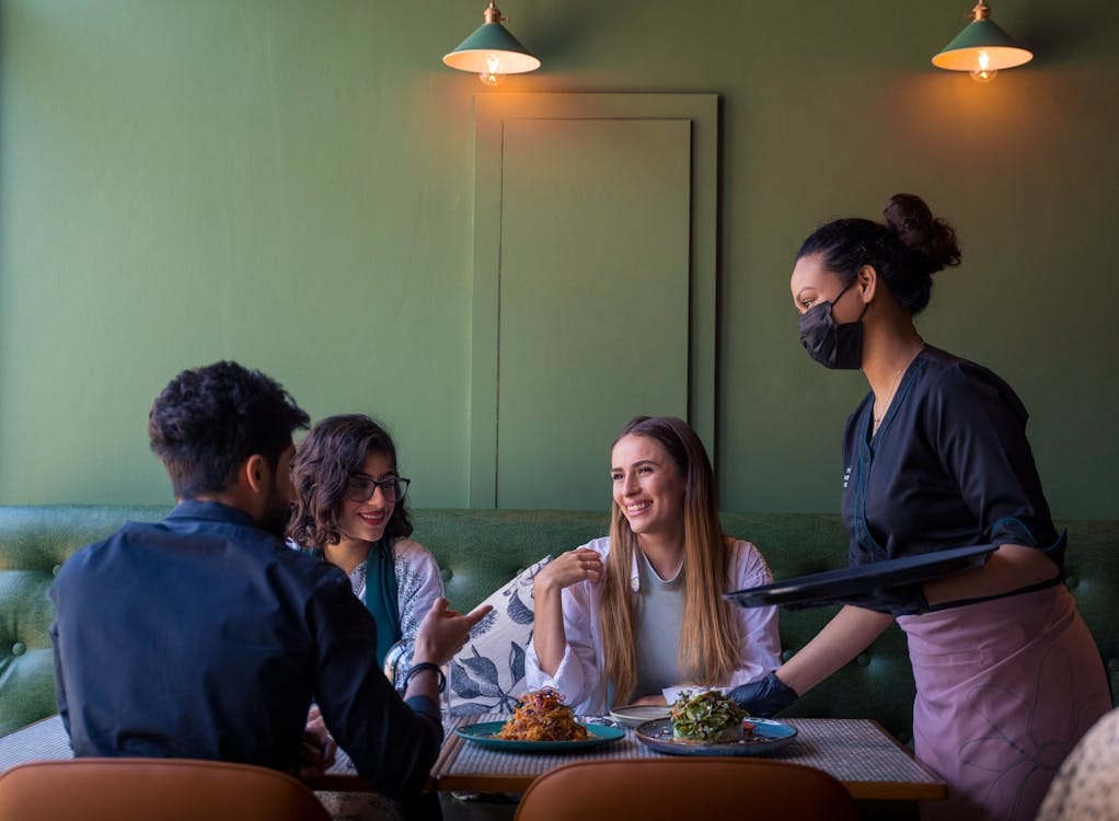 Free Friends Sitting at the Table Stock Photo