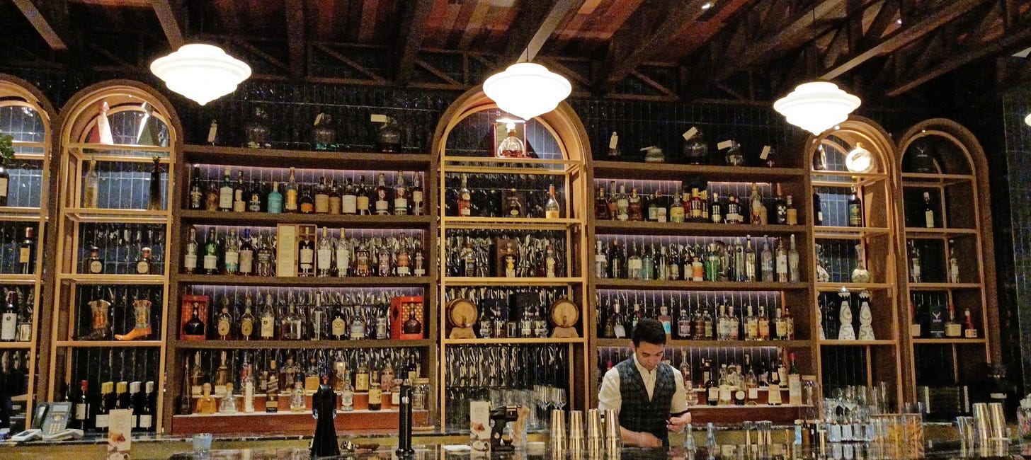 bar counter with lots of bottles