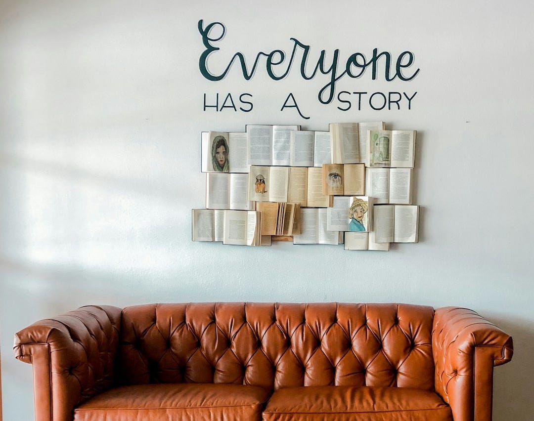 a brown leather couch sitting in front of a white wall a brown leather couch sitting in front of a white wall