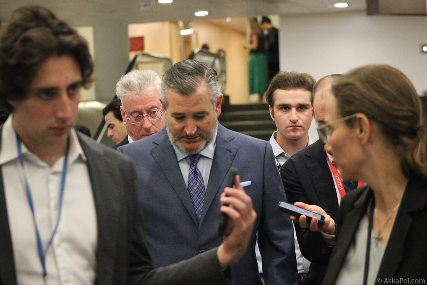 Politician looks at ground as reporters ask him questions Photo Logan Johnson © AskaPol.com Politician looks at ground as reporters ask him questions Photo Logan Johnson © AskaPol.com