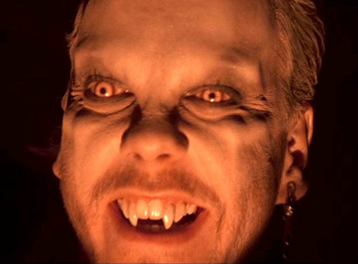 David with vampire fangs and glowing eyes David with vampire fangs and glowing eyes