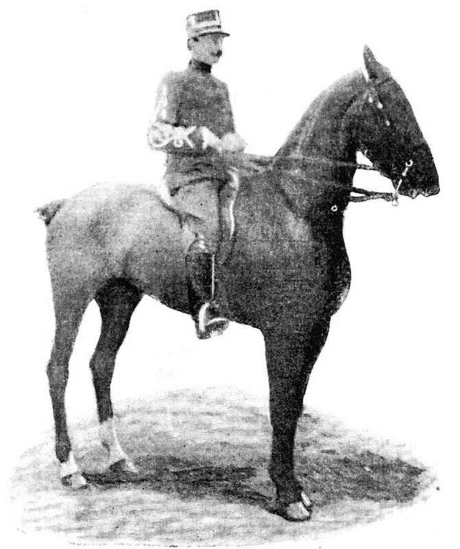 Gold medalist Constant van LanghendonckA grainy black and white image of a man sitting astride a horse. He is dressed up in fancy army-looking regalia.