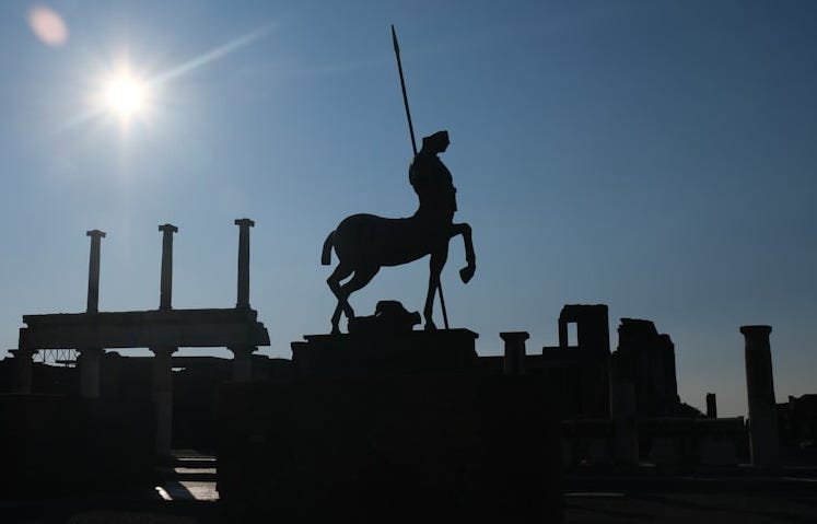 a statue of a person on a horse