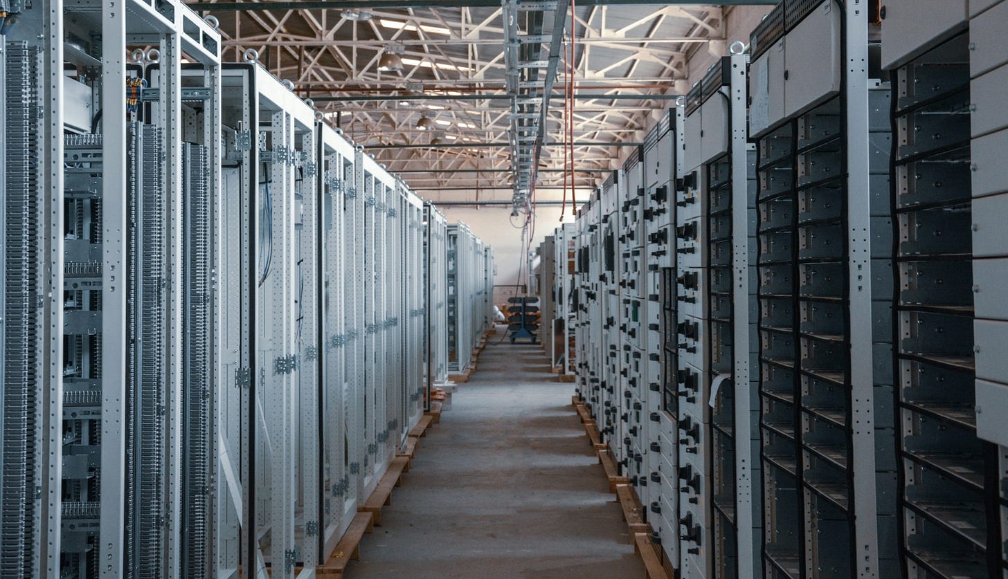 server room aisle with metal equipment racks server room aisle with metal equipment racks