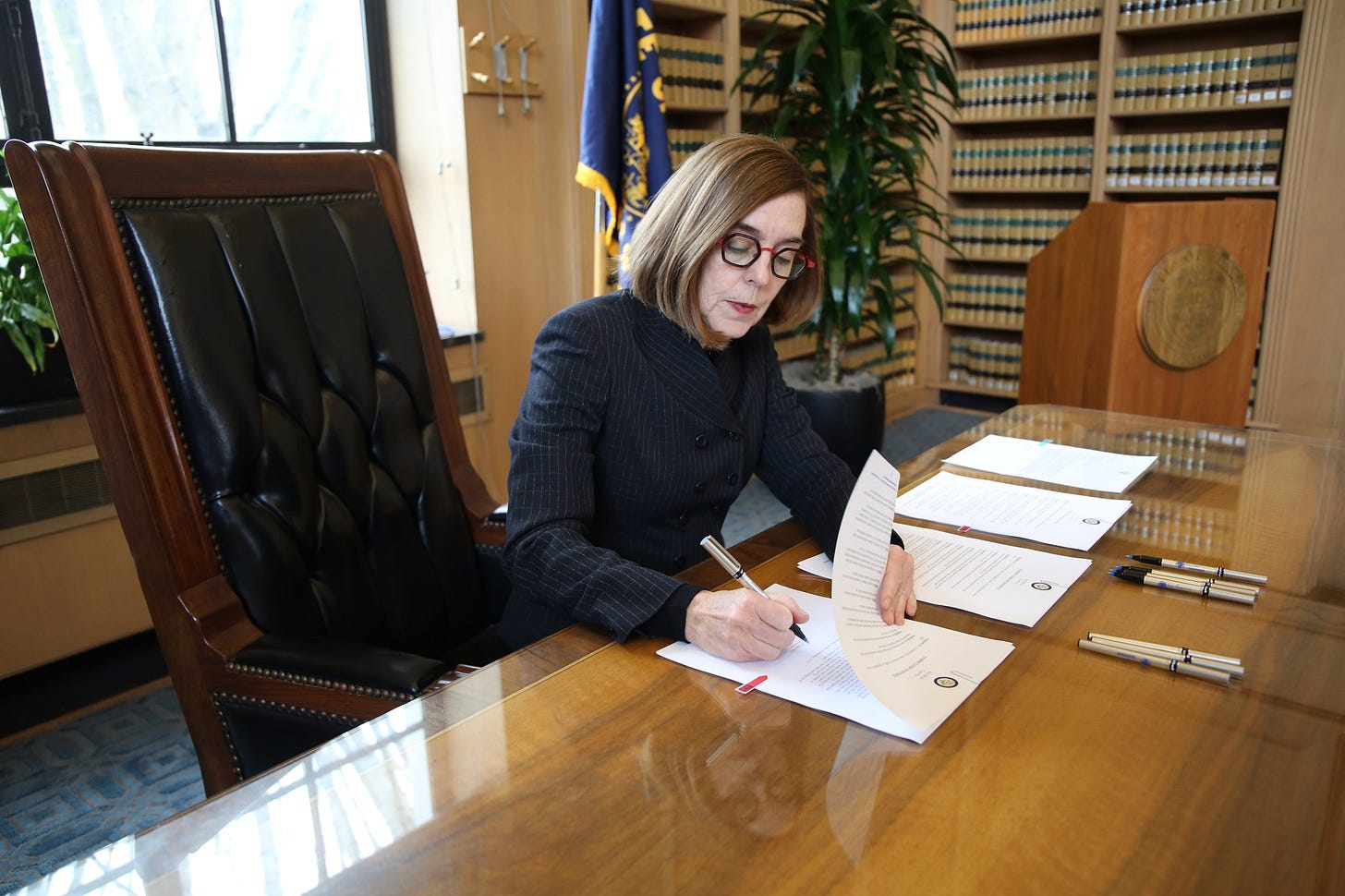 May be an image of 1 person, sitting, office and indoor