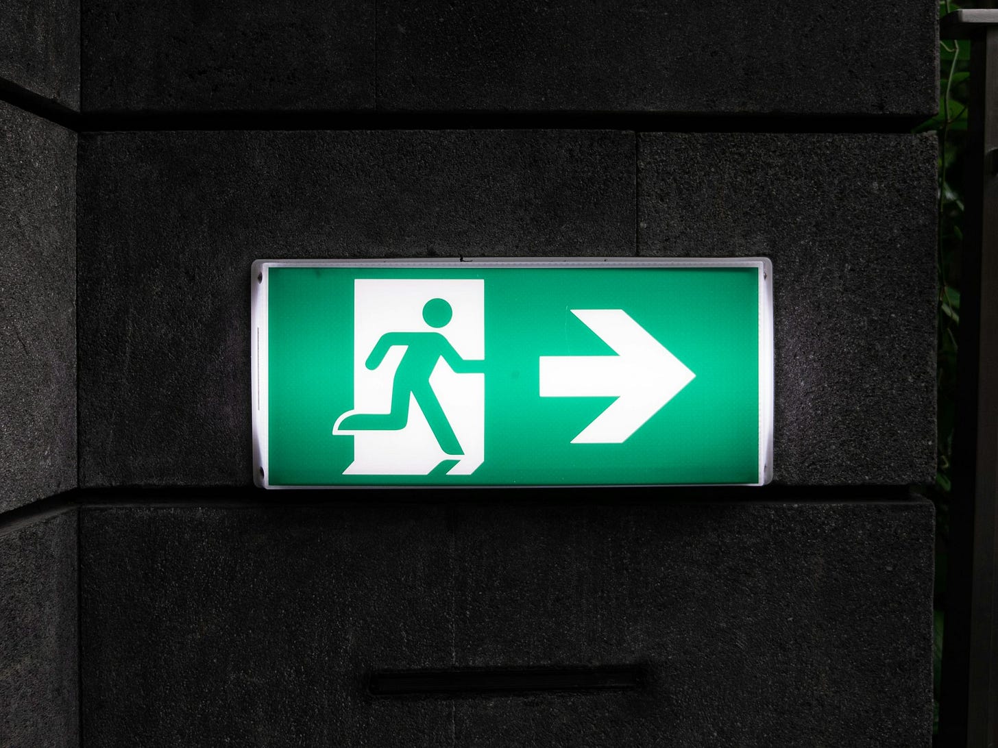 white and green Exit sign