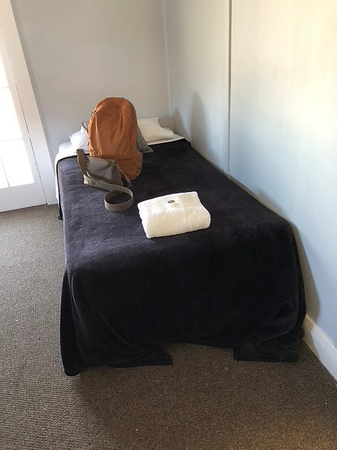 Exterior hotel, book cover and a single bed