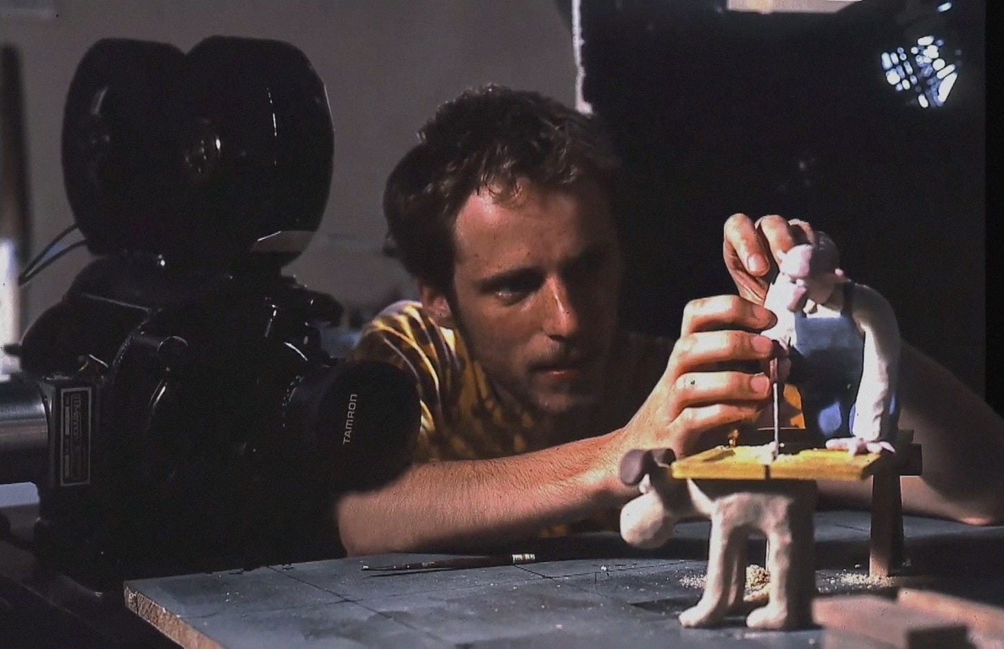 Nick Park animating Wallace and Gromit figures in his workspace