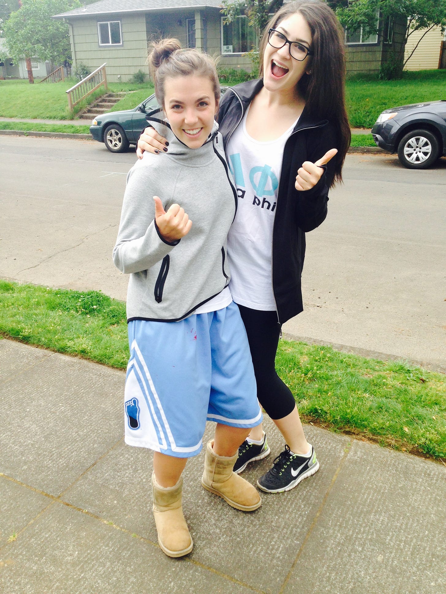 Myself and my friend Zoe posing for a photo, both of us with a thumbs up. I'm in my Nike jacket, basketball shorts, and Ugg boots uniform. Myself and my friend Zoe posing for a photo, both of us with a thumbs up. I'm in my Nike jacket, basketball shorts, and Ugg boots uniform.