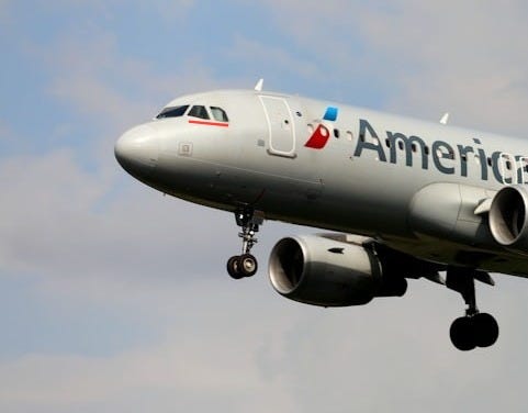 a large airplane flying in the sky a large airplane flying in the sky