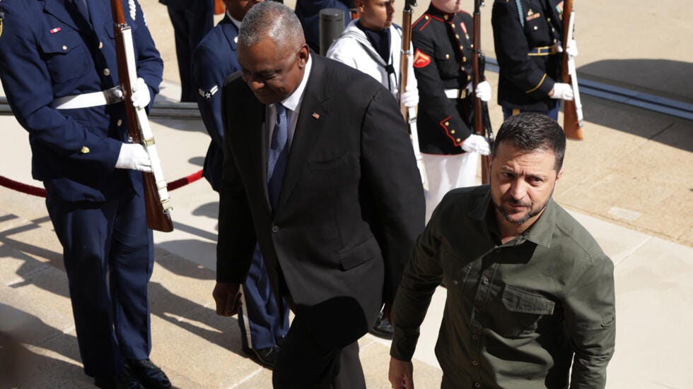 File photo of  US Defence Secretary Lloyd Austin welcoming Ukrainian President Volodymyr Zelensky at Pentagon headquarters in Arlington taken on September 21, 2023.