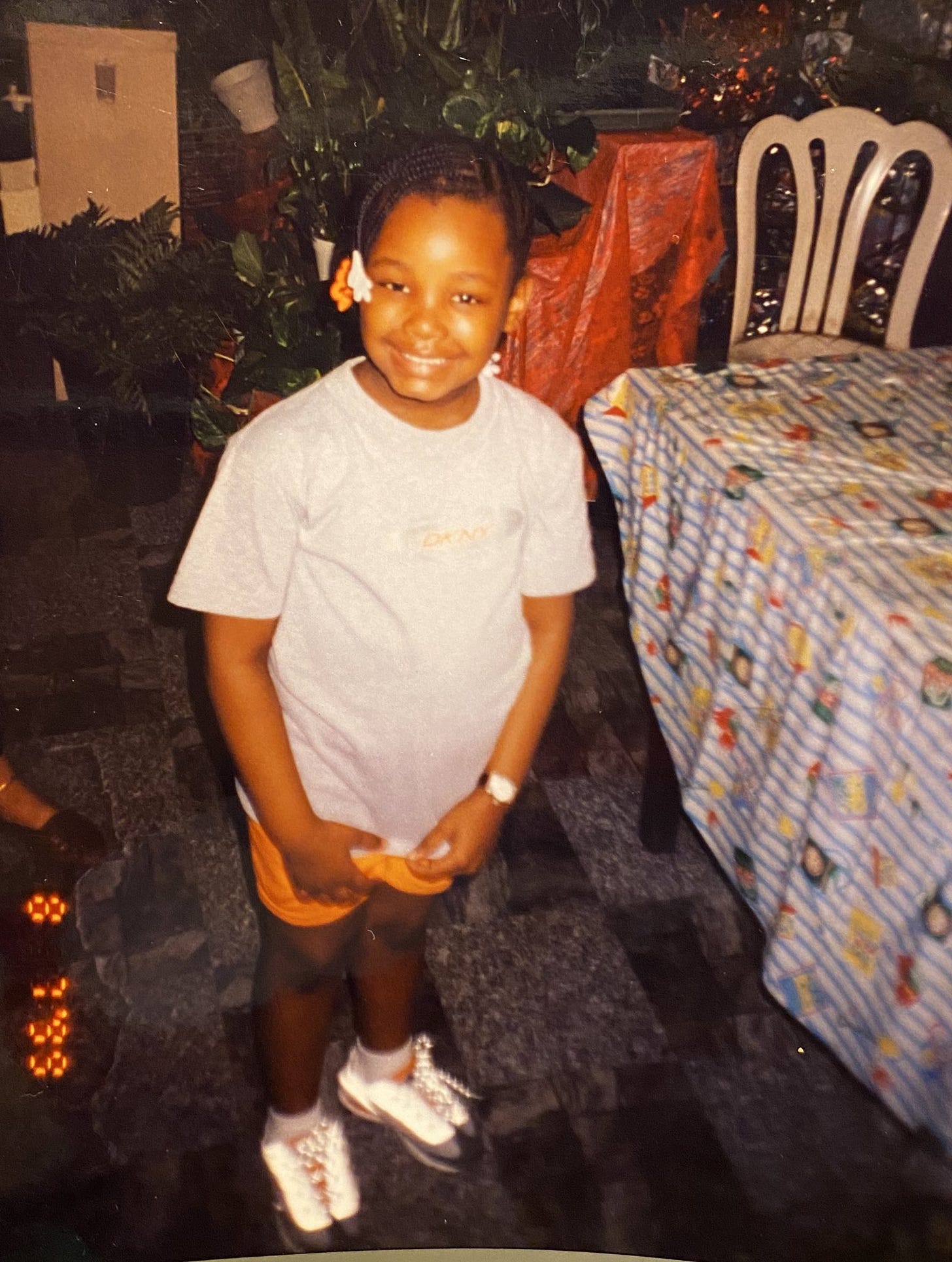 A young Fly Girl Mik circa 1999 sporting a pair of orange Air Max 95s the fly pages on substack